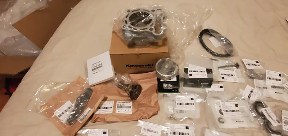 Genuine Kawasaki OEM parts, including a new cylinder, piston kit and camshaft