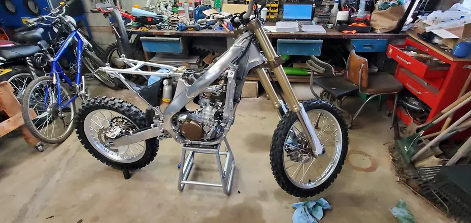 Dirt bike rolling chassis with the rebuilt engine installed