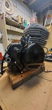 Finished vintage two-stroke engine with the Kawasaki clutch cover